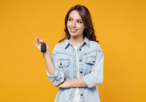 A person holding the keys to the new car they just purchased near Carmel, Indiana