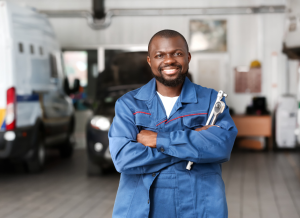 A service technician holding a tool in a shop near Carmel, Indiana