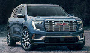 A 2025 GMC Acadia photographed from the front angle, parked on gravel near Carmel, Indiana