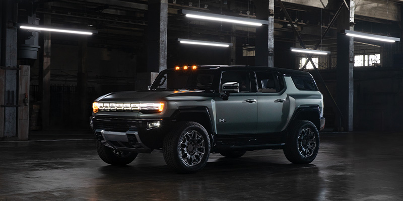 An all-new GMC Hummer parked in a dimly lit warehouse. - Ed Martin Buick GMC Carmel, IN