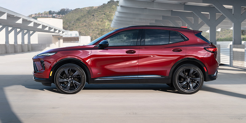 A dark red 2025 Buick Envision parked on the roof of a parking structure near Carmel, IN